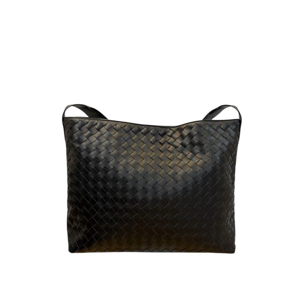 Black woven handbag on a white background