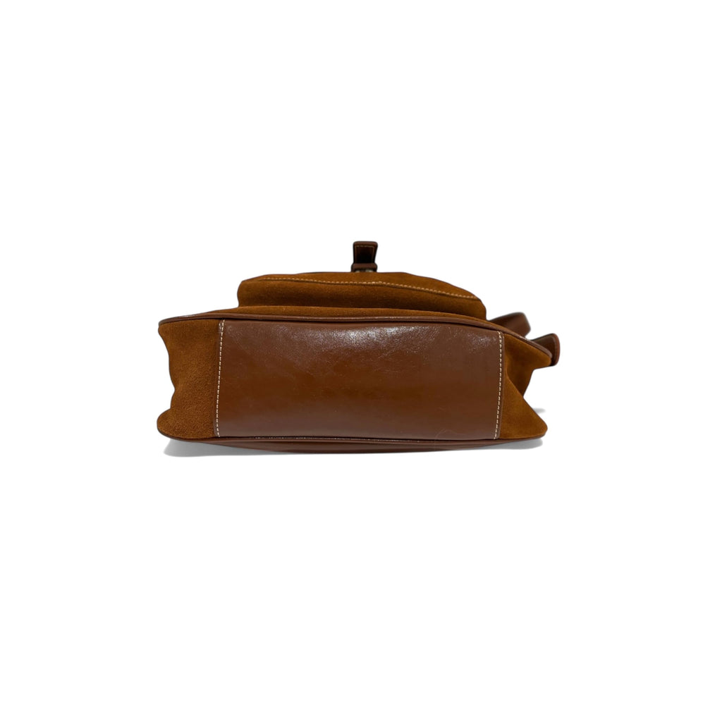 Brown leather bag on a white background