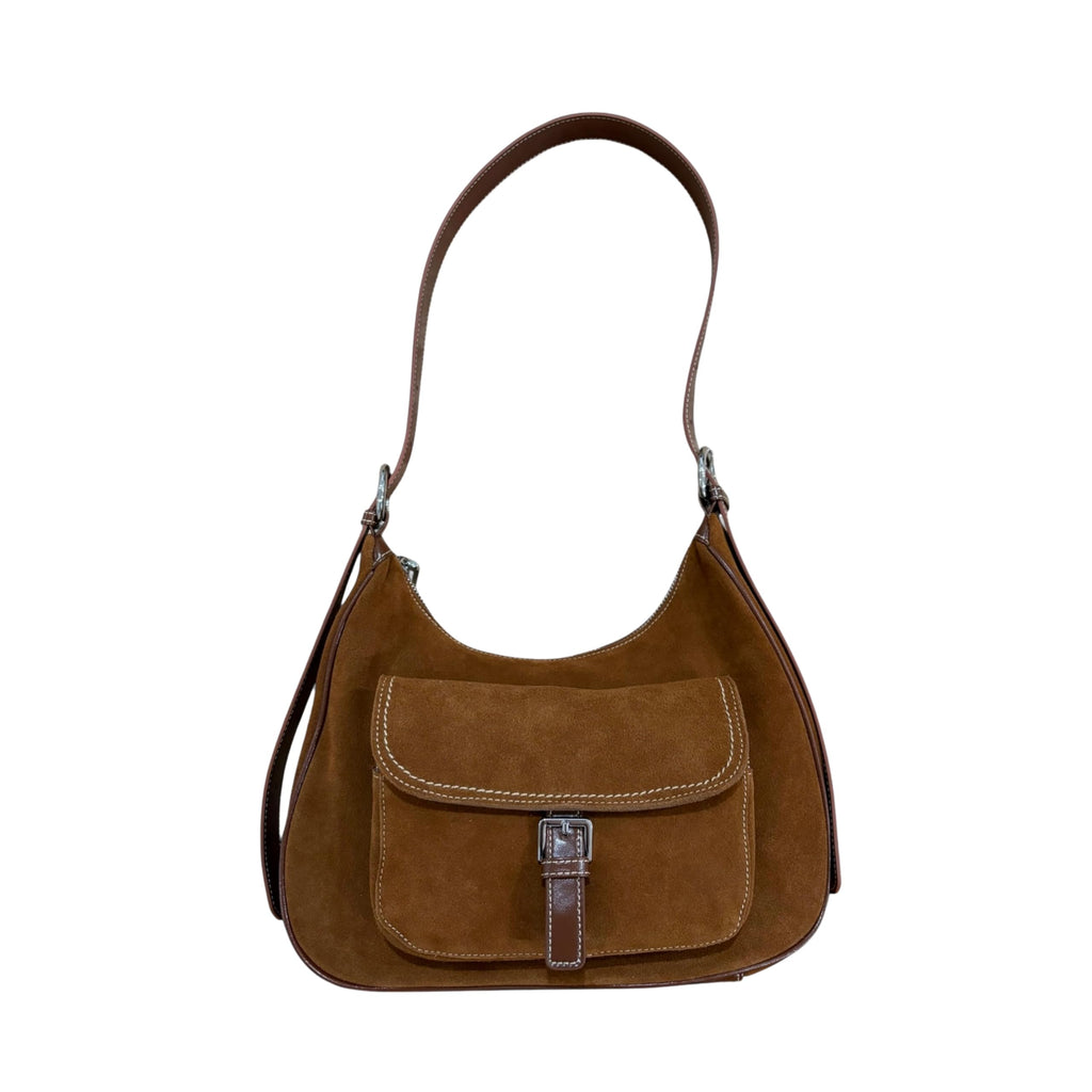 Brown leather handbag with a strap on a white background