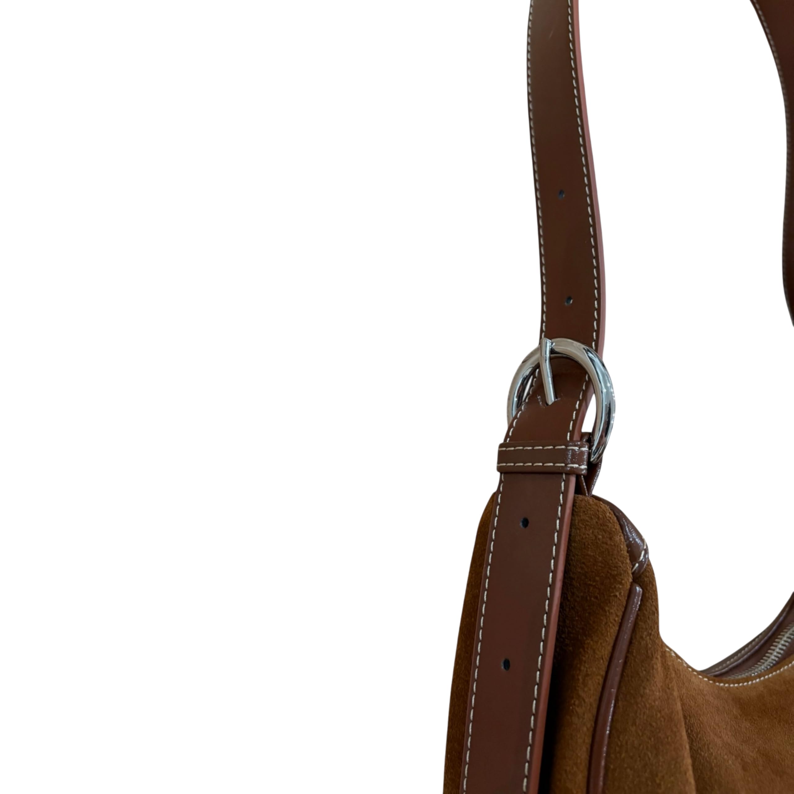 Close-up of a brown leather strap with a silver buckle on a white background