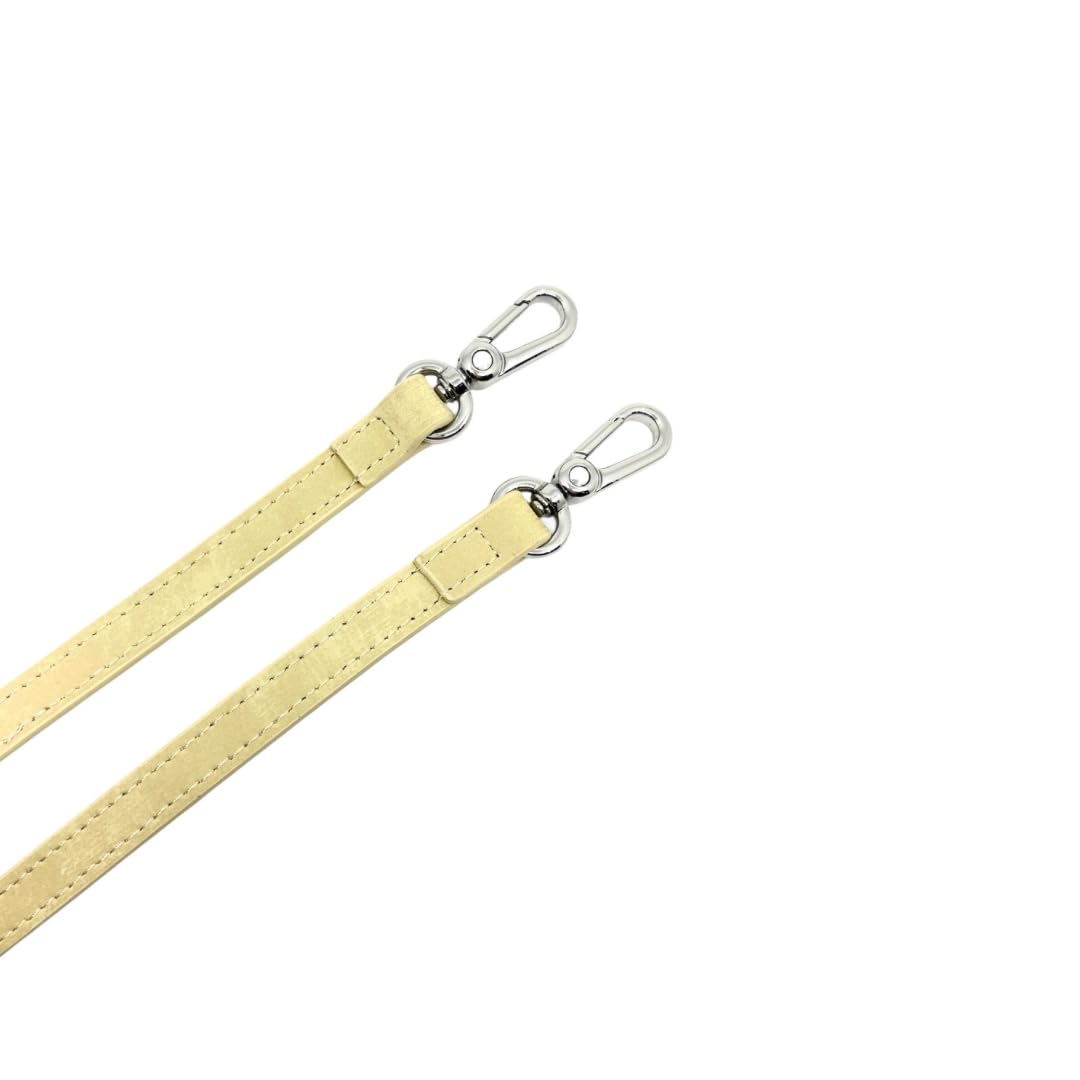 Golden yellow leather straps with silver hardware on a white background