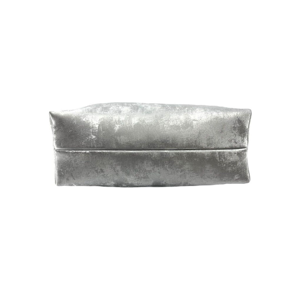 Silver metallic clutch bag on a white background