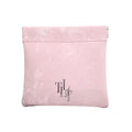 Pink pouch with a logo on a white background